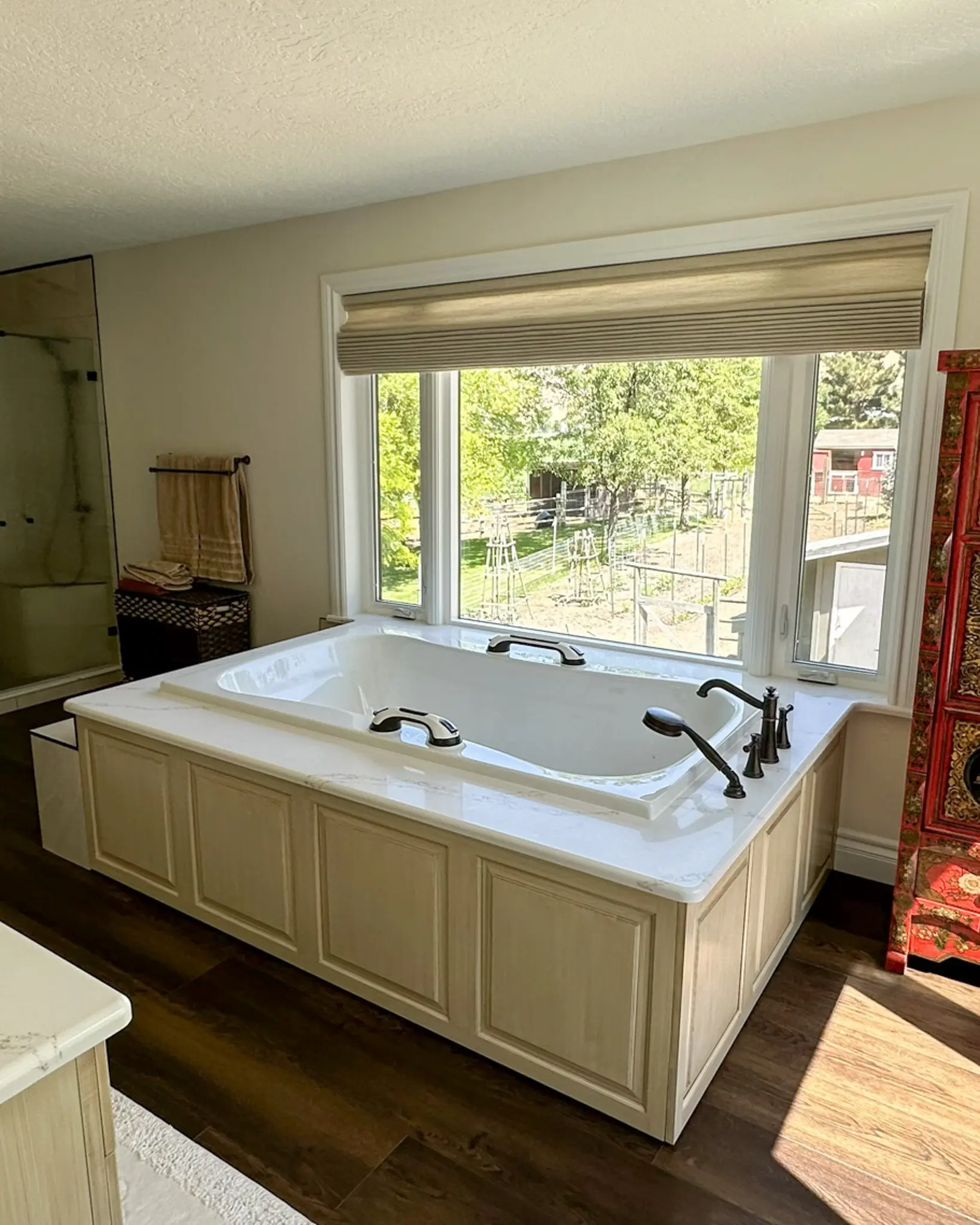 A remodeled bathroom with freestanding tub.